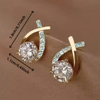 Stud earrings with golden cross and zirconia